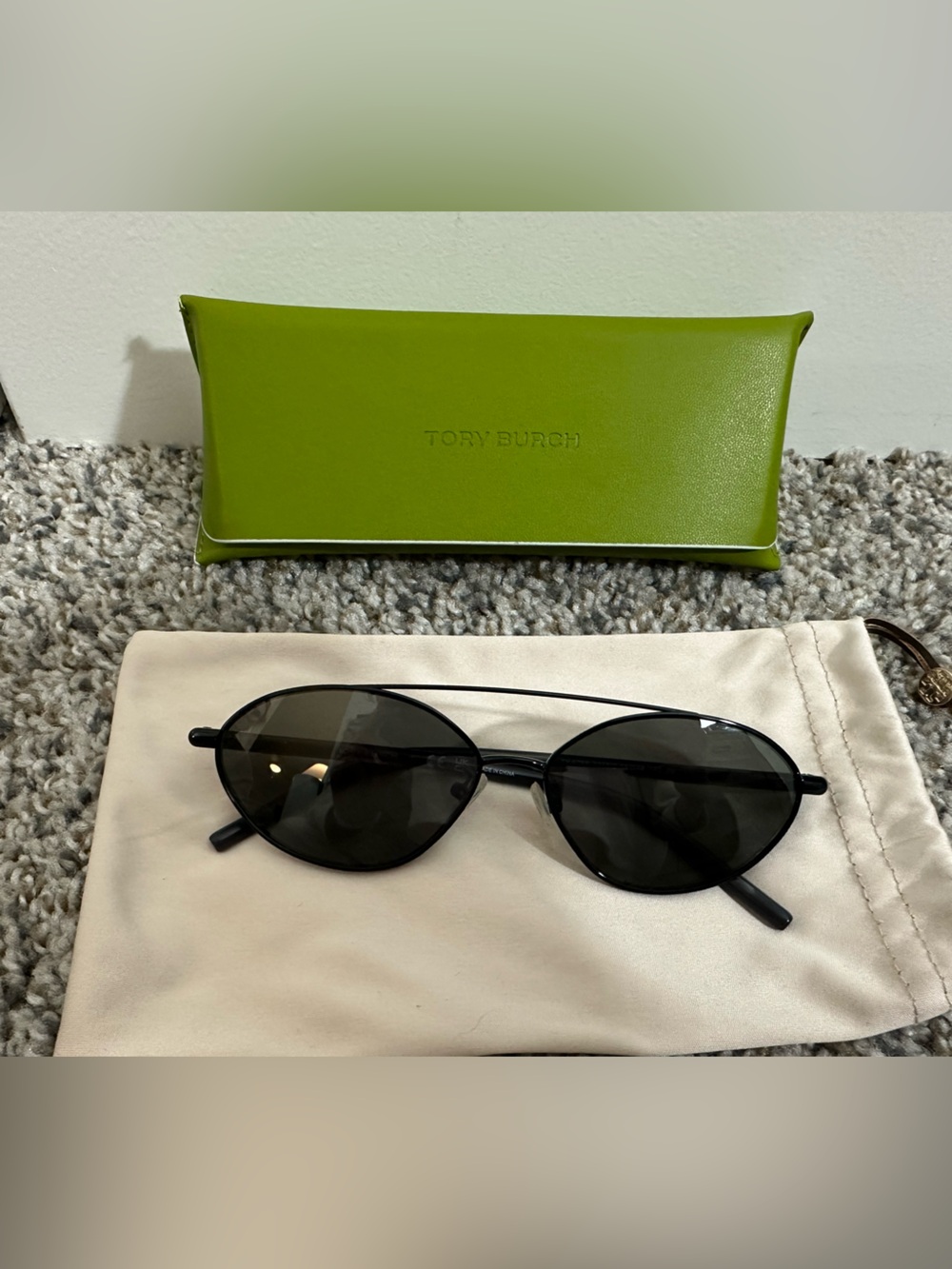 Tory Burch Black Oval Sunglasses with Dark Lenses